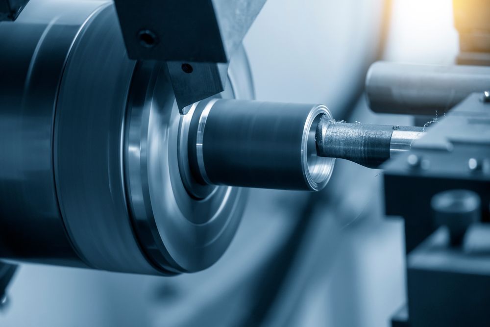A Machine is Cutting a Piece of Metal on a Lathe — LM Engineering In Mareeba, QLD