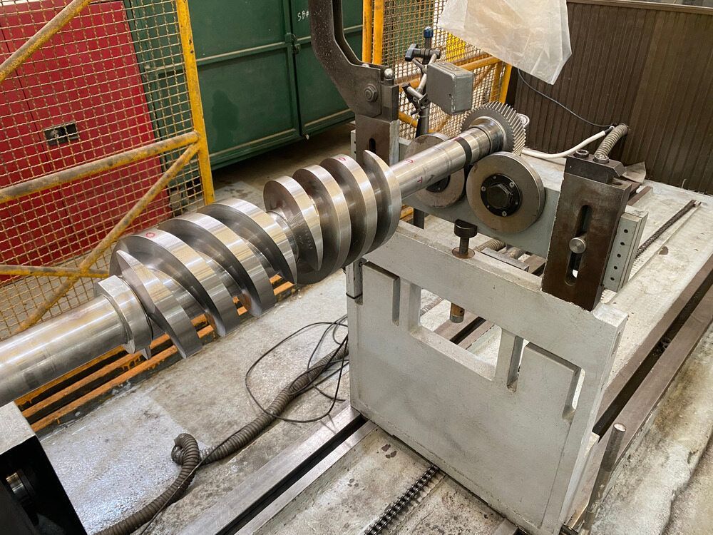 A Machine is Cutting a Piece of Metal in a Factory — LM Engineering In Mareeba, QLD