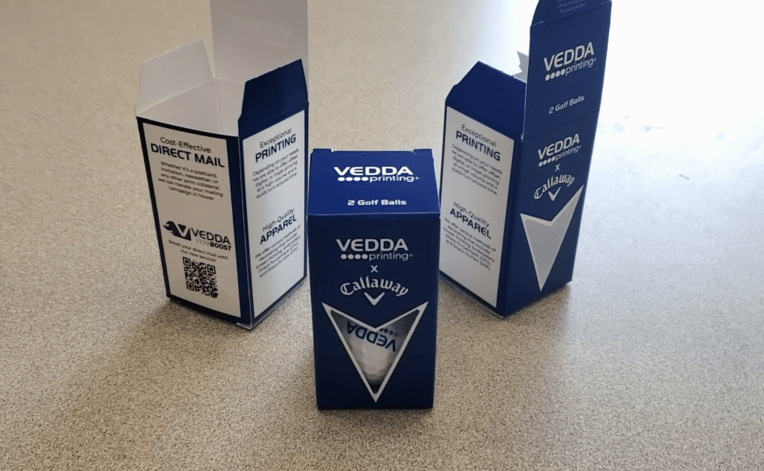Display of Vedda Printing's golf ball packaging
