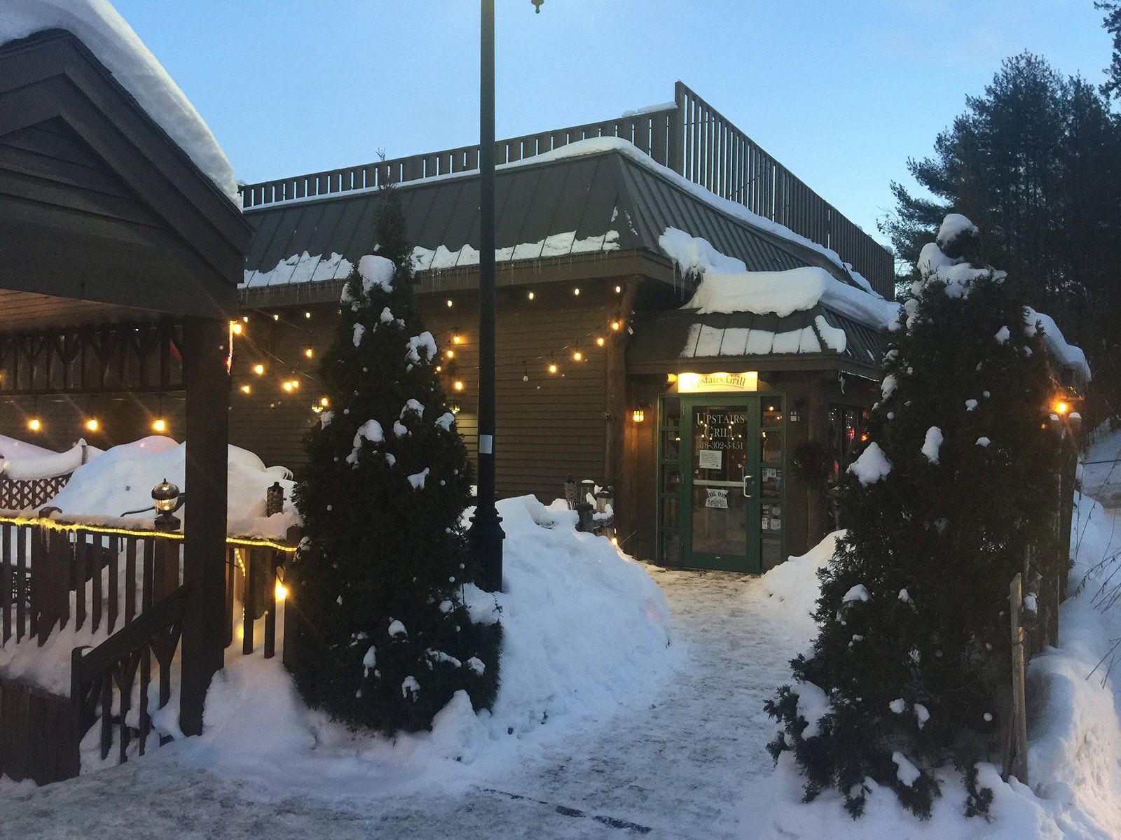 Upstairs Grill Restaurant in the winter with snow and lights.