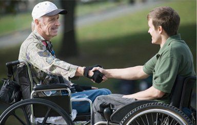 Veteran shaking hands - Veteran's Benefits in Burlington, VT
