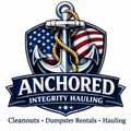 Logo for Anchored Integrity Hauling featuring a nautical anchor, American flag background, and service text below.