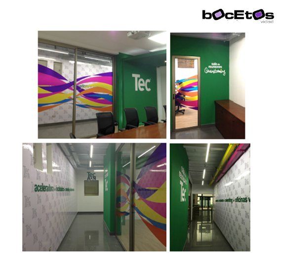 Cuatro vistas de un pasillo de oficina moderno con paredes verdes, coloridos murales y mamparas de cristal.