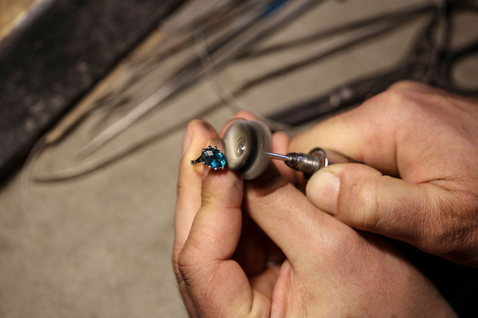 Jeweller polishing a ring | Toowoomba, QLD | Aztec Jewellers & Valuation Services