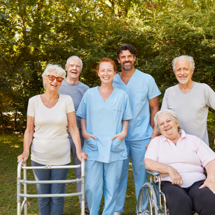 A group of people posing for a picture with one woman in a wheelchair