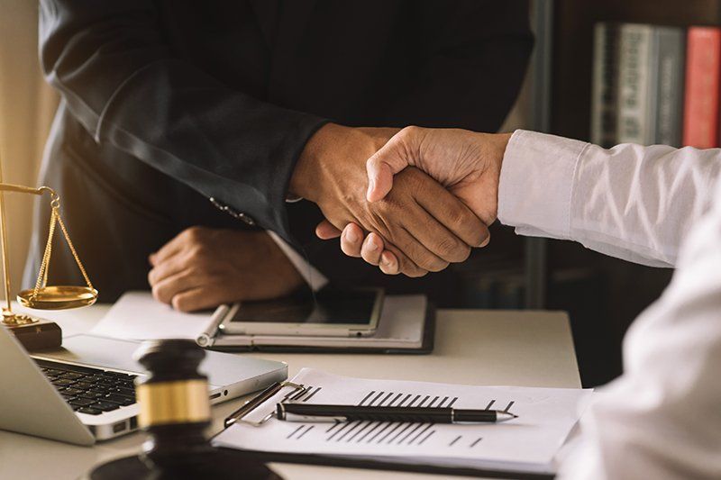 Attorney and client shaking hands