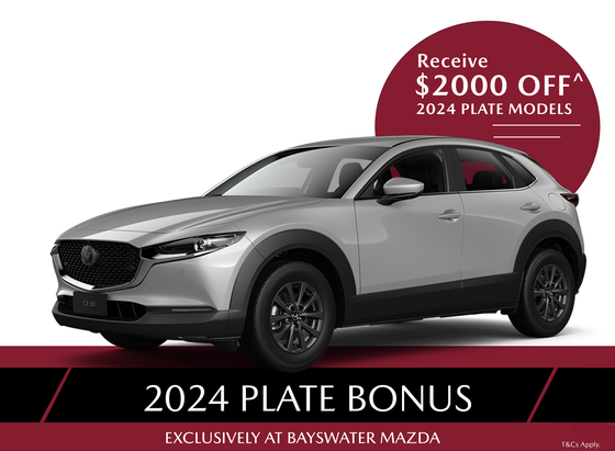 A red mazda cx-30 is shown on a white background.