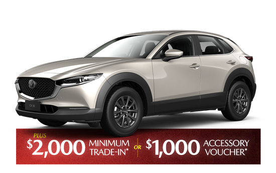 A red mazda cx-30 is shown on a white background.