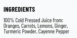 Bottle of orange juice with orange slice, ginger, and carrot in front of green foliage.