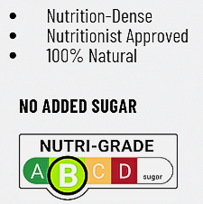 Hand holding three small juice bottles, yellow, green, and red, in a natural setting with foliage.