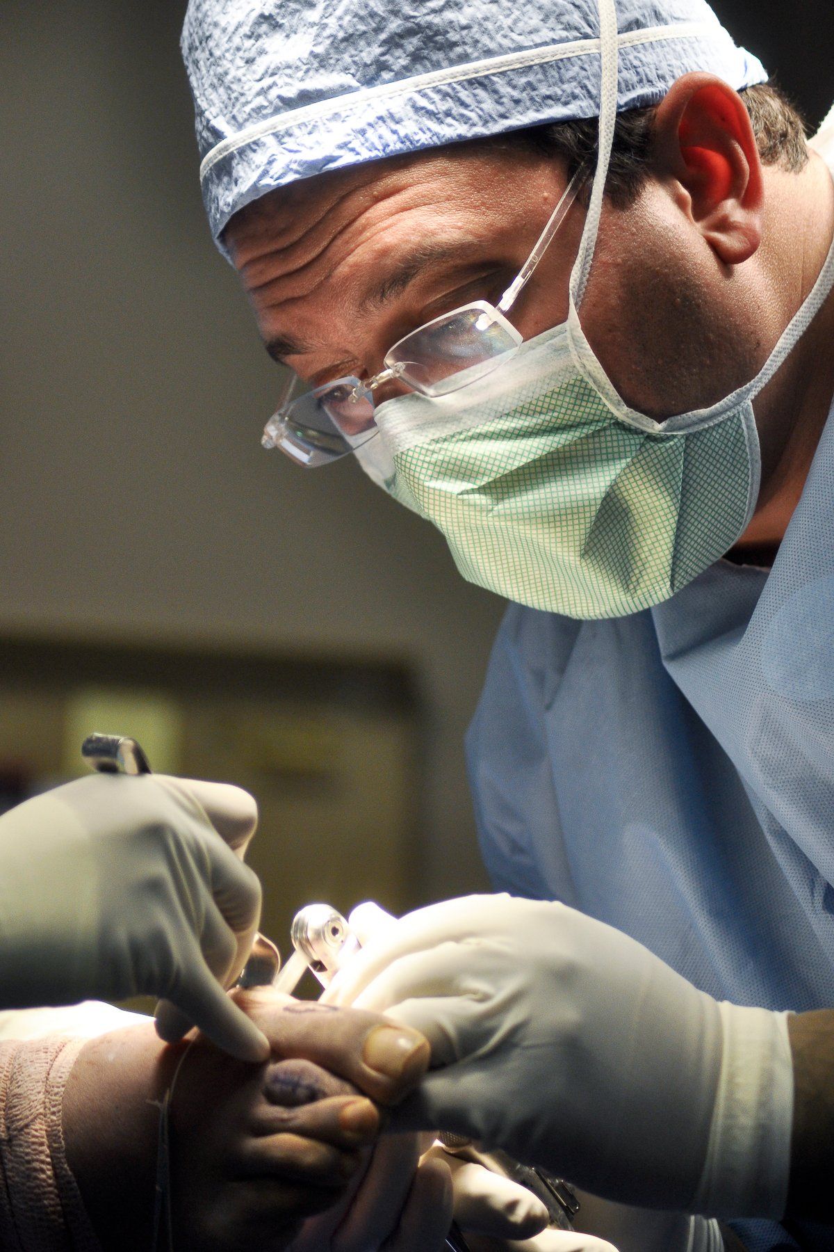 Experienced surgeons performing surgery