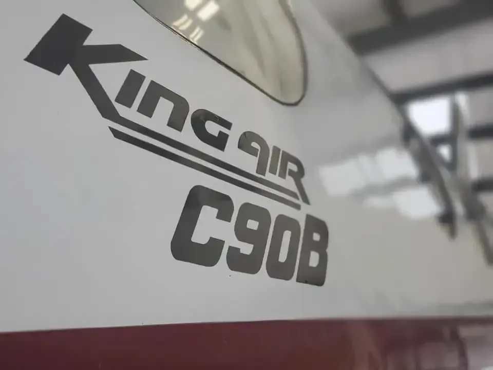 A close up of a king air c90b plane