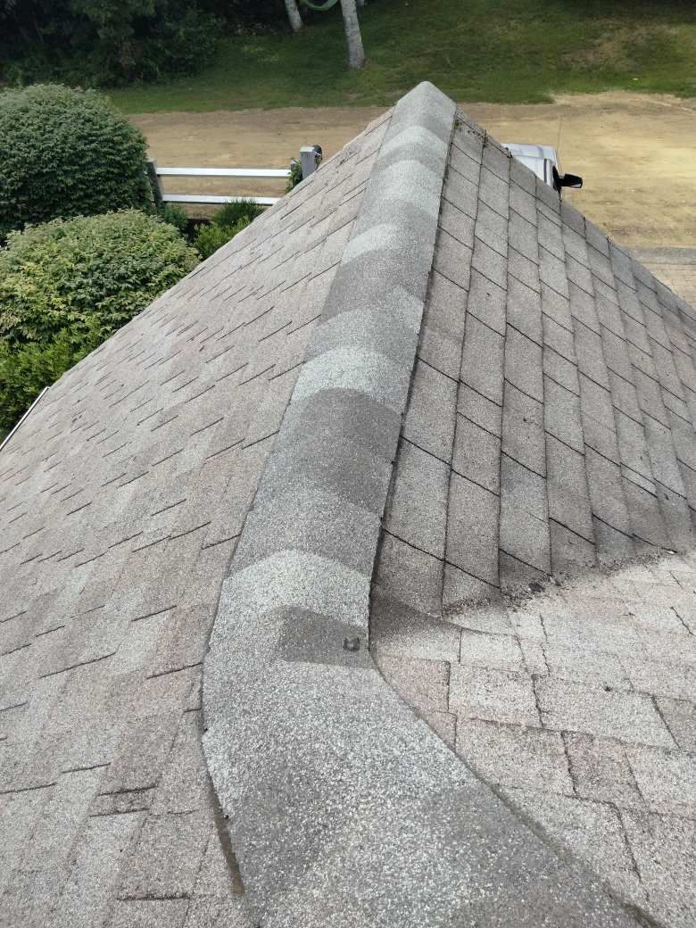 A close up of a roof with shingles on it.