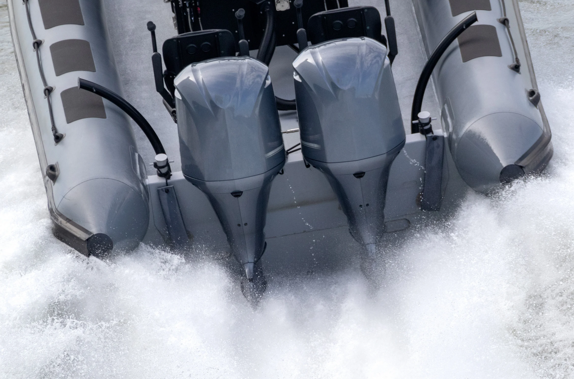 A boat with two engines is going through the water