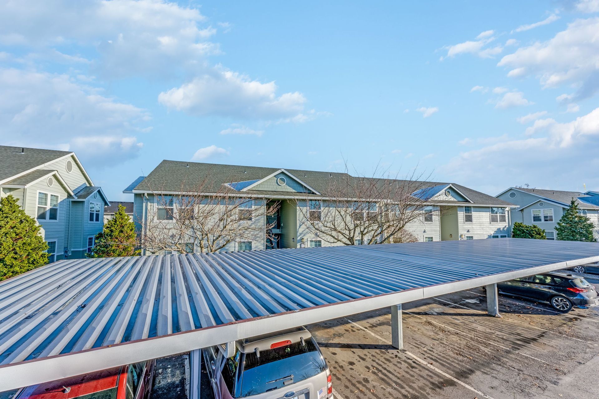 View of apartment building over carport.