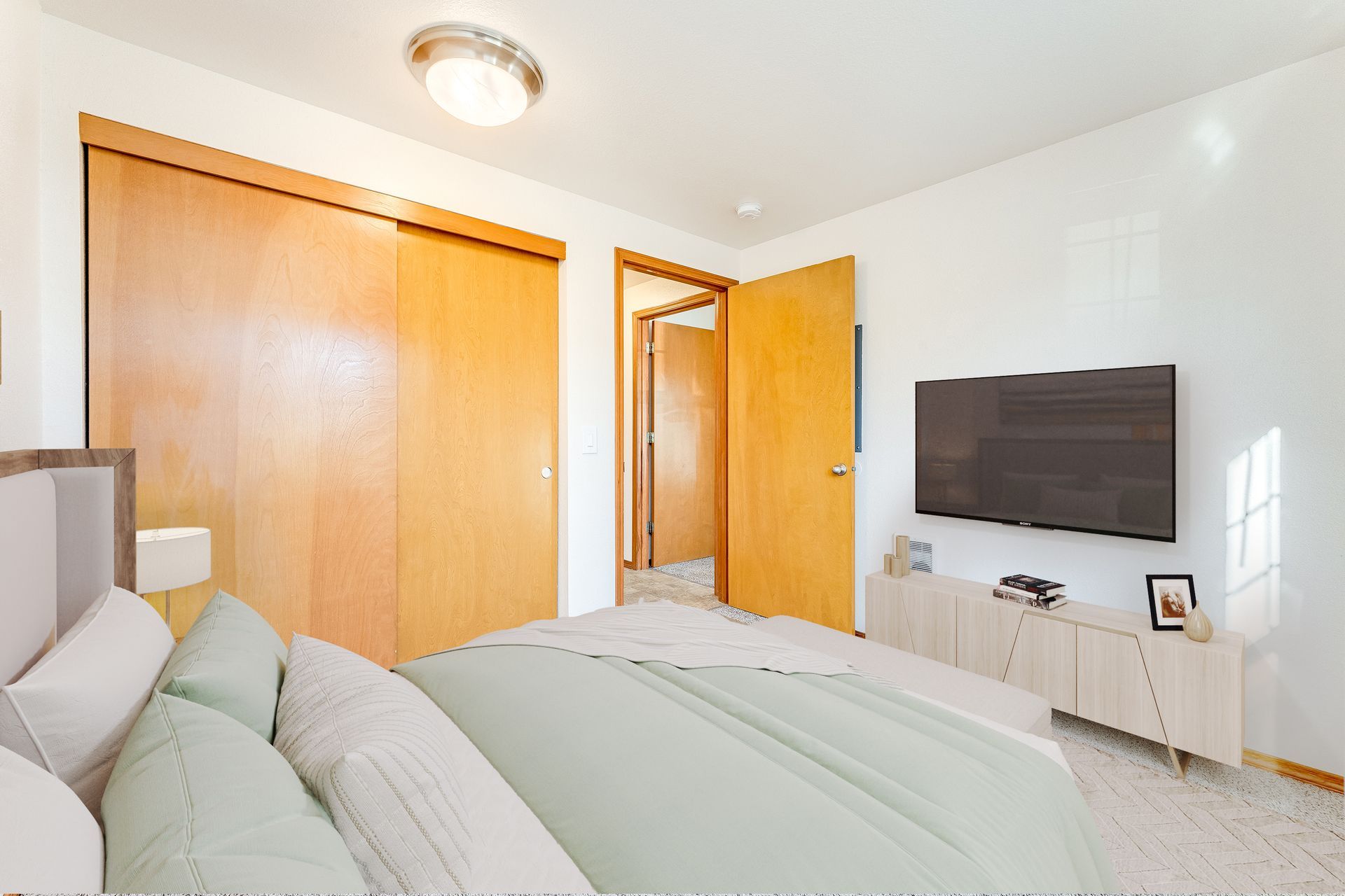 Spacious bedroom with view of closet.