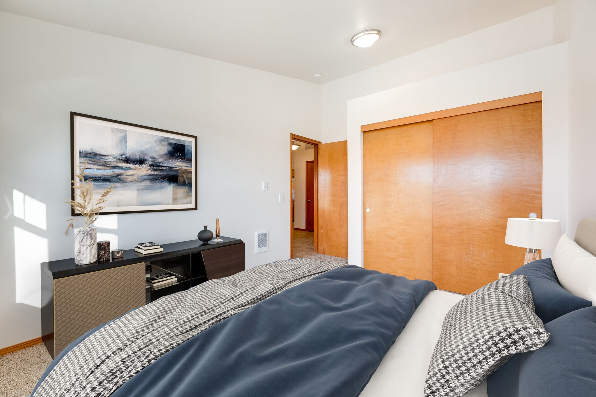 Bedroom with view of large closet and door to the left.