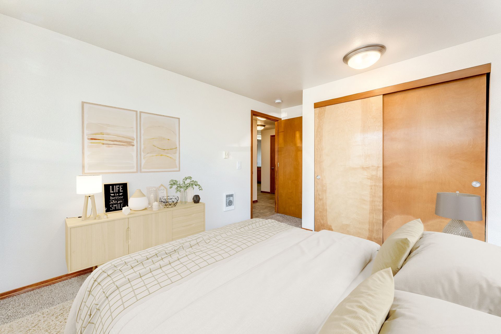 Corner bedroom with view of spacious closet.