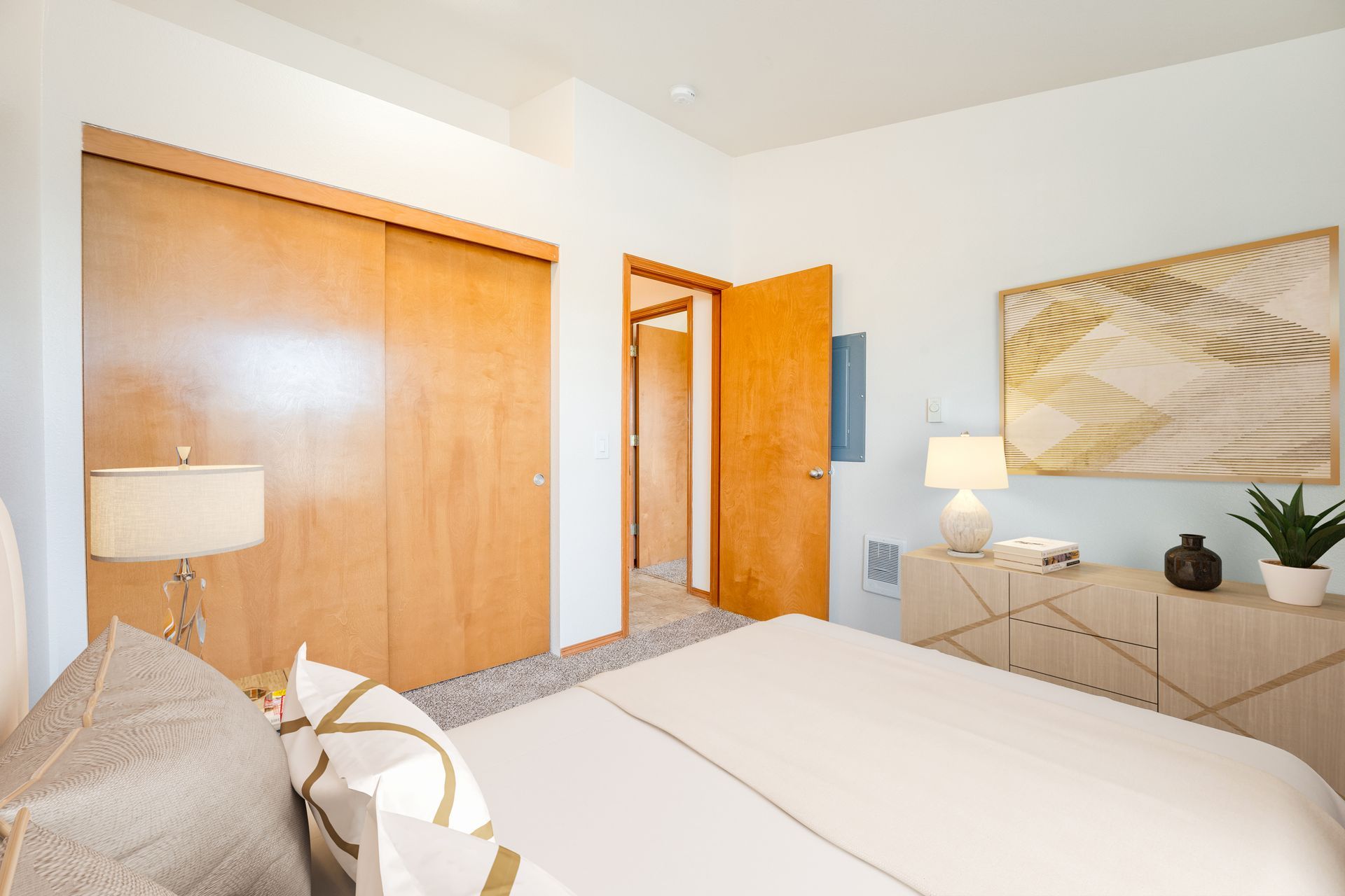 Bedroom with view of large closet and door to the right.