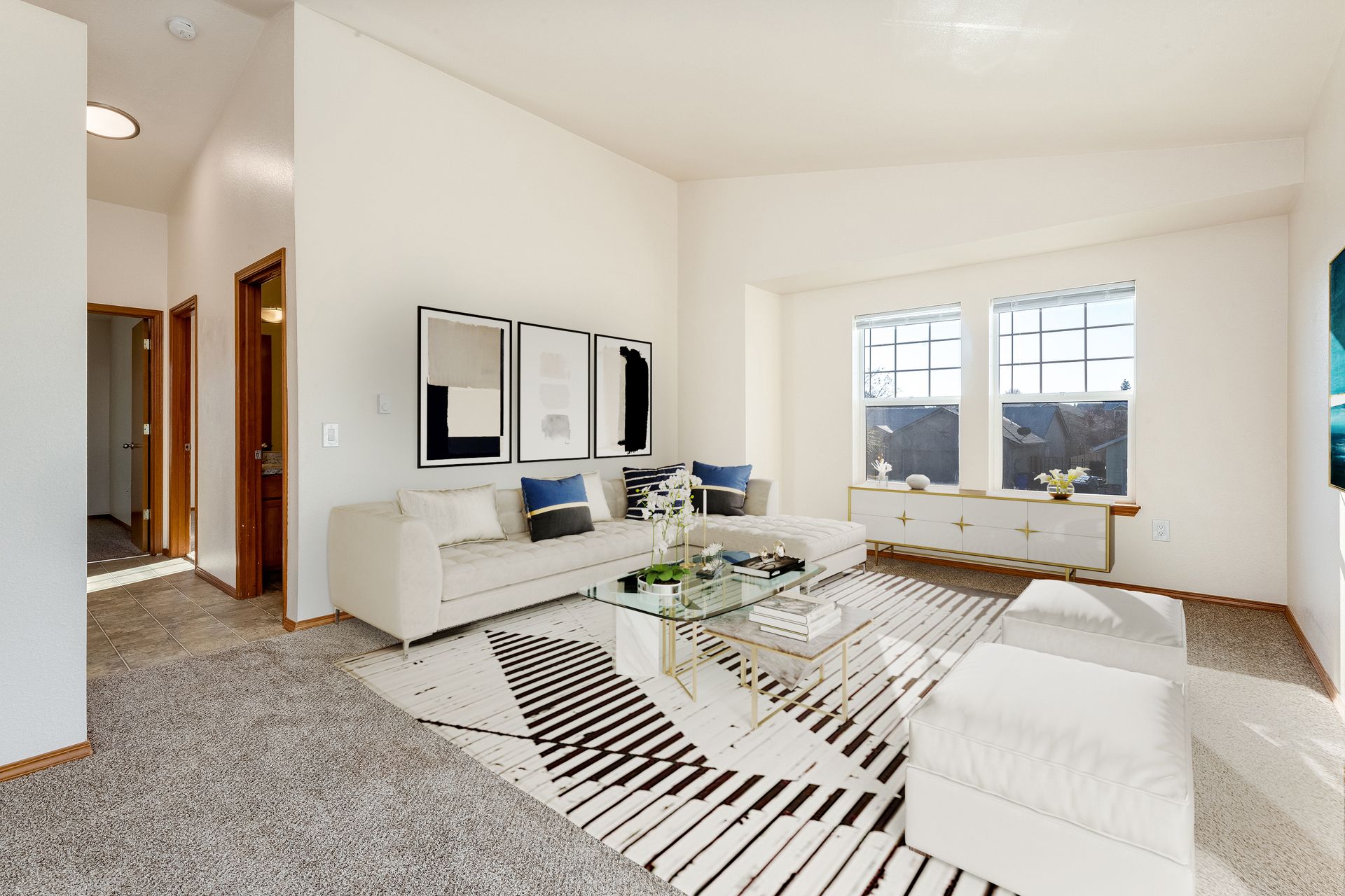 Living room with vaulted ceilings.
