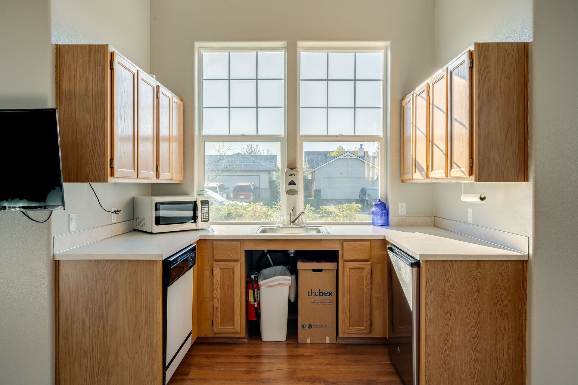 Recreation room with kitchenette tucked into nook.