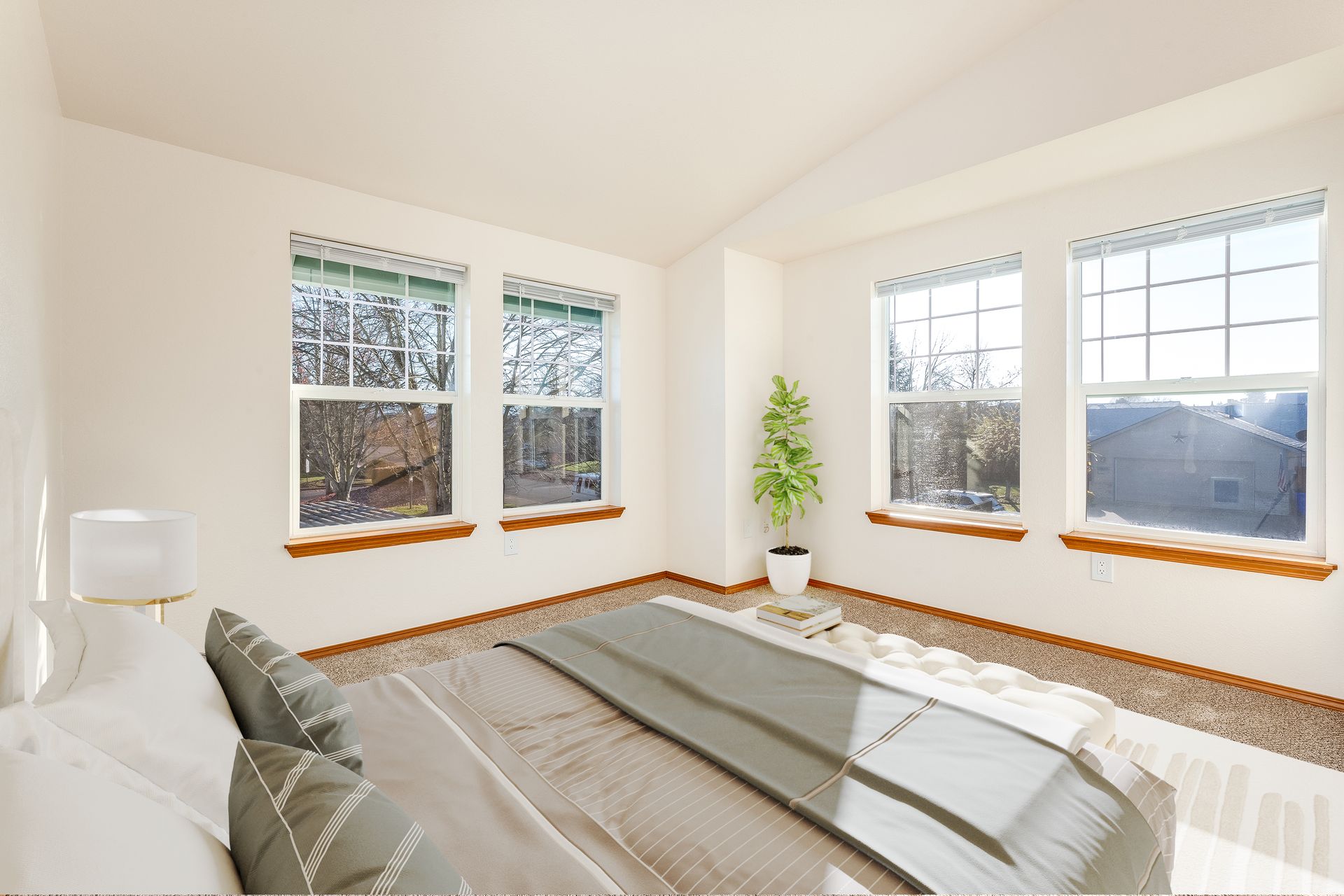 Bedroom two with  large windows.