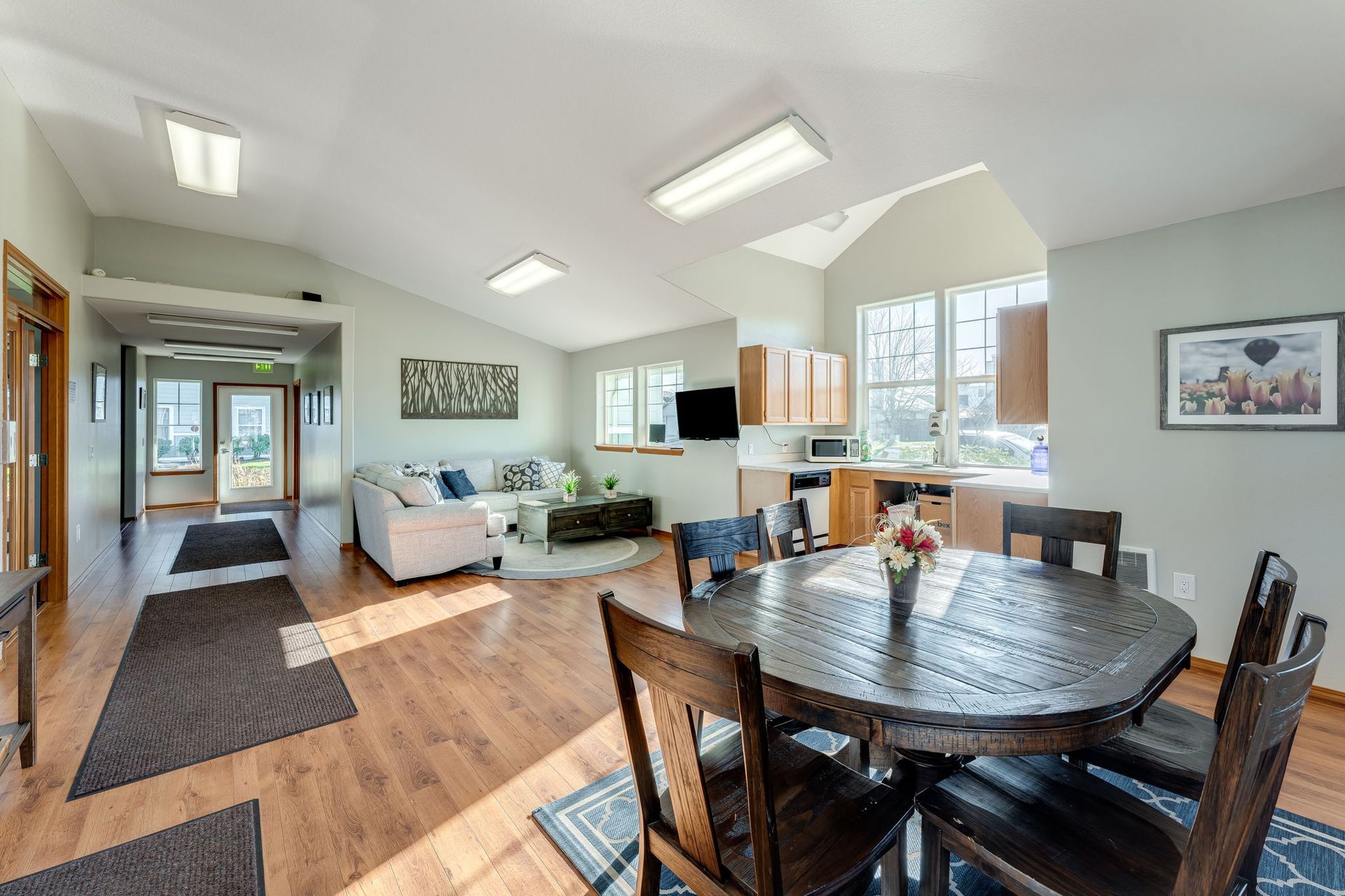 Recreation room with view of dining area and living space and kitchenette in the background.