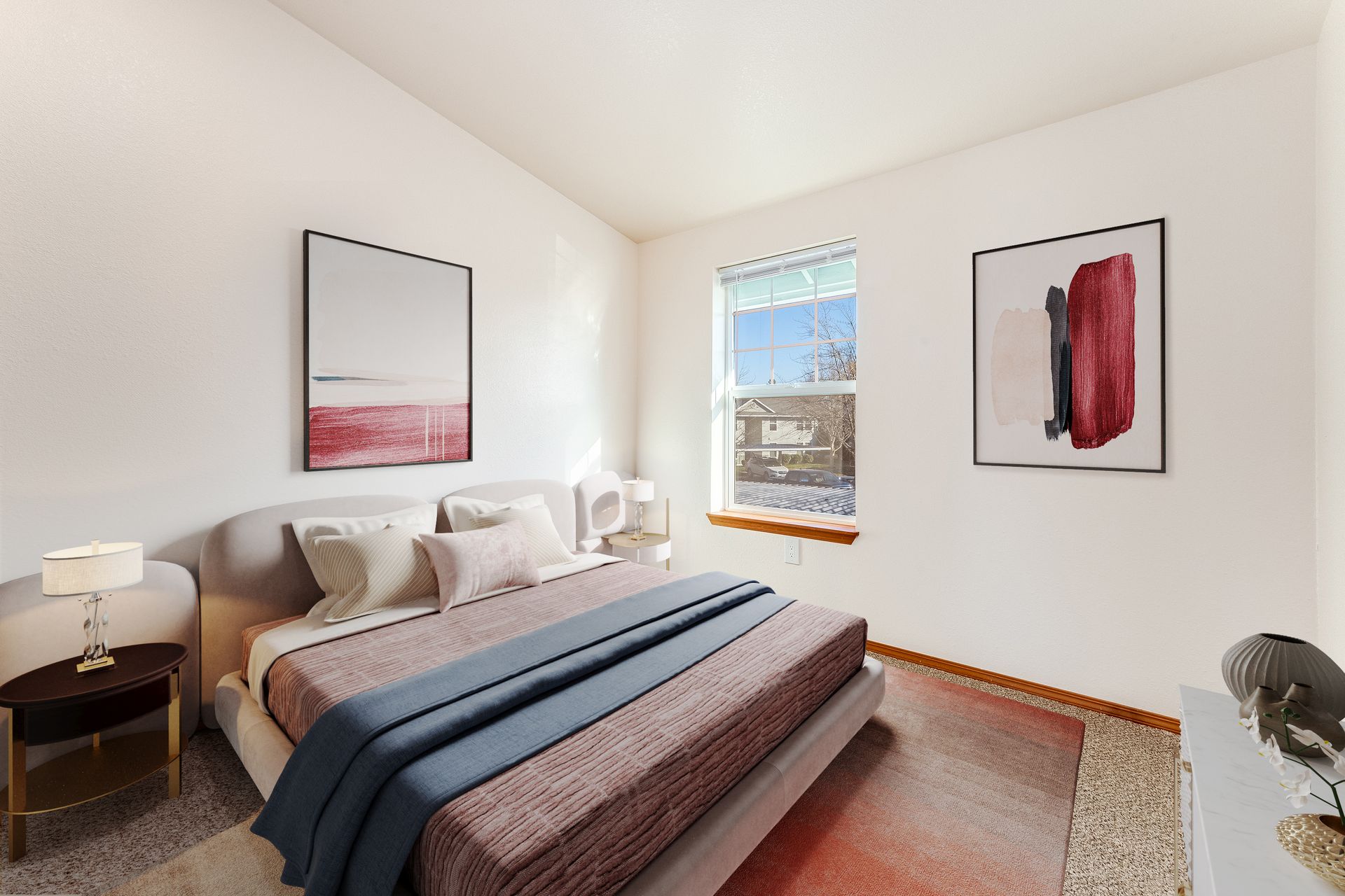 Ample sized bedroom with large window.