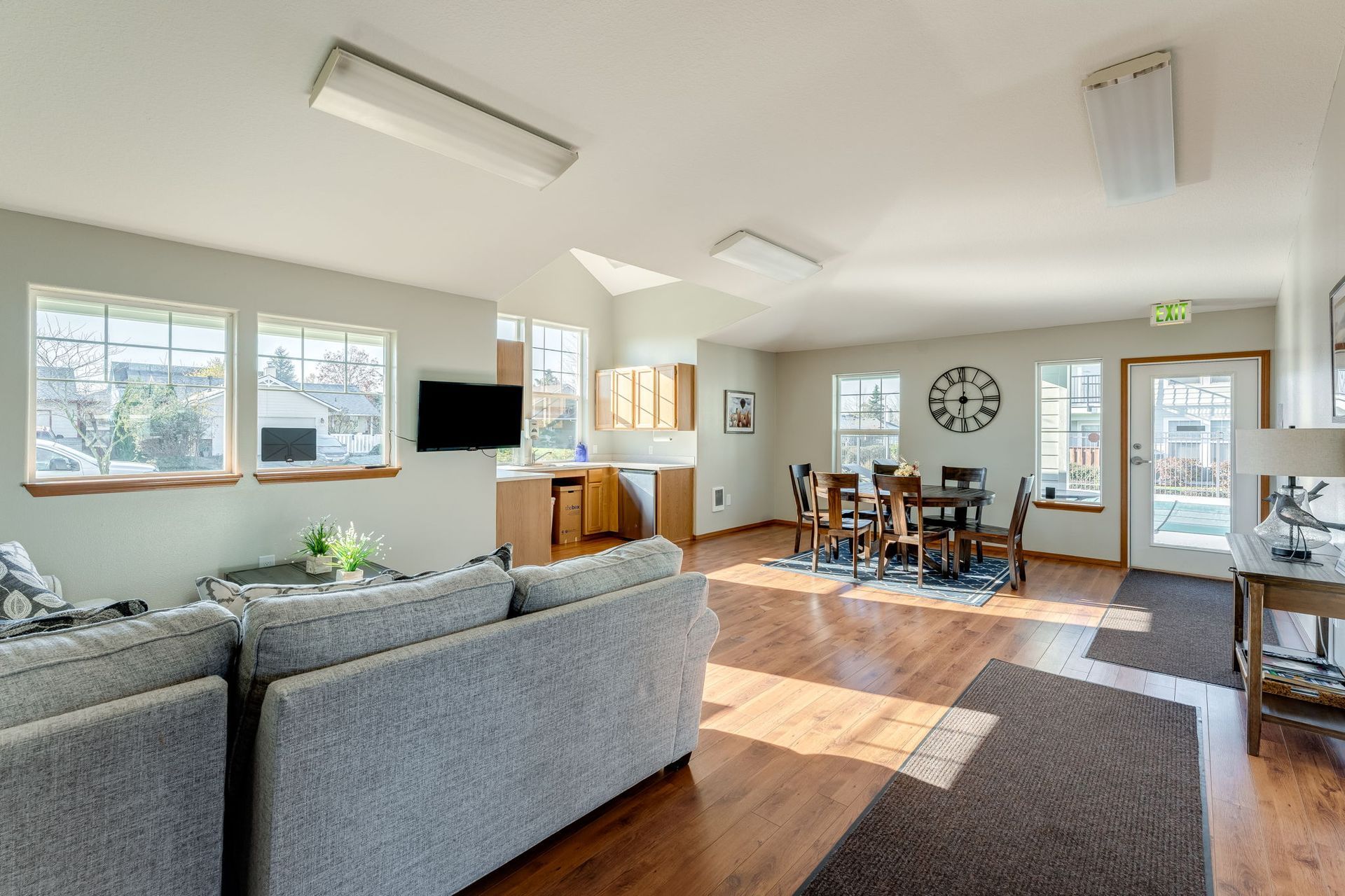 Recreation room with view of furnished  living space and dining area and kitchenette in the background.