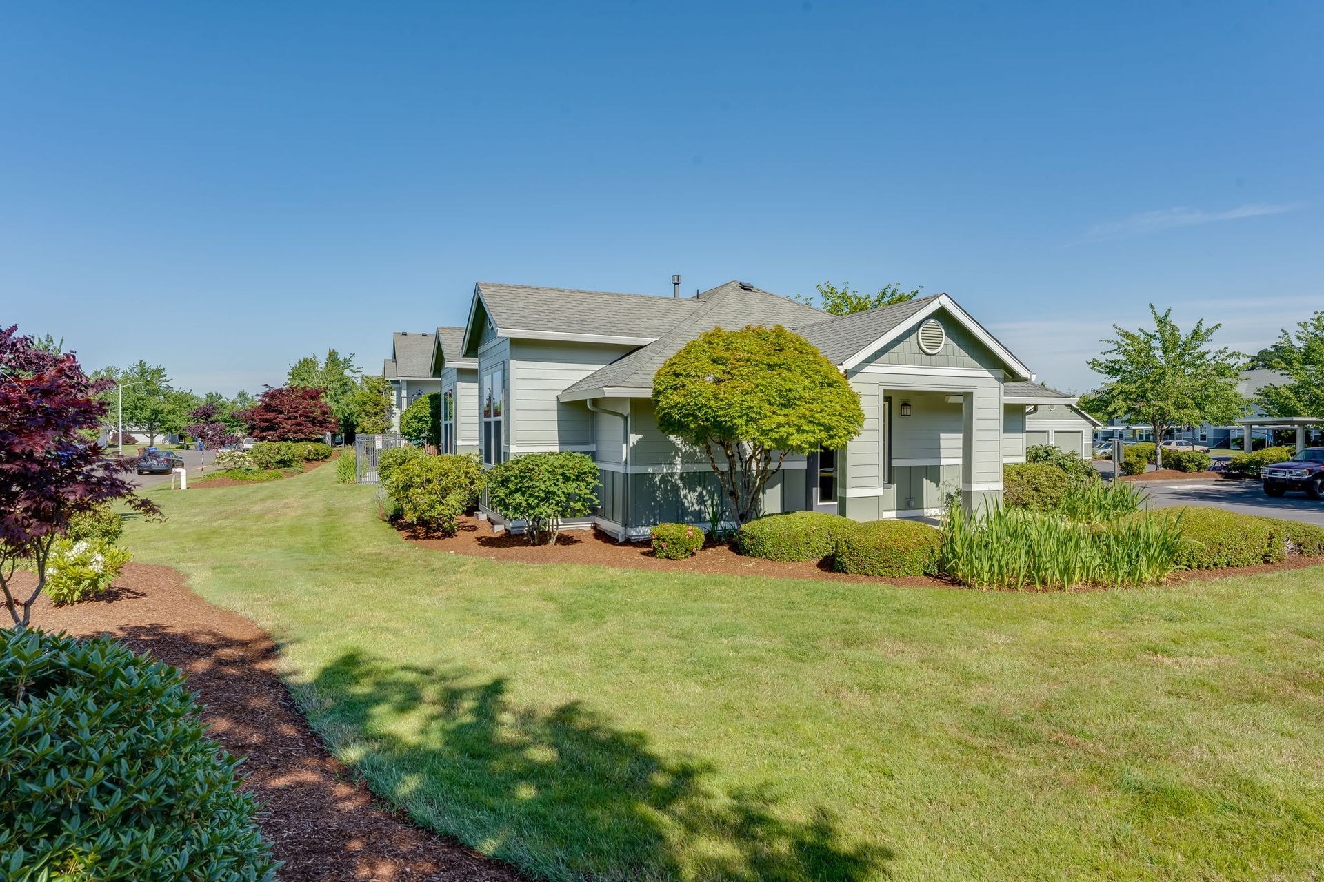 Building exterior with beautifully landscaped grounds.