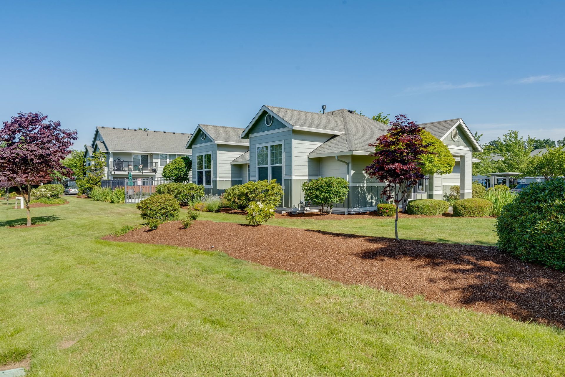 Building exterior with beautifully landscaped grounds.