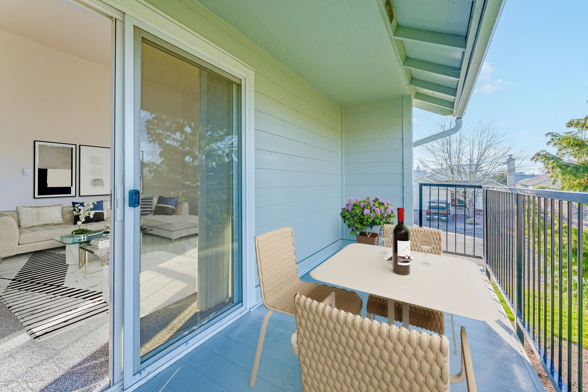 Back deck off living room through sliding glass doors.