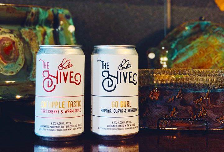 Two Beer Cans with metallic labels from The Hive Taproom