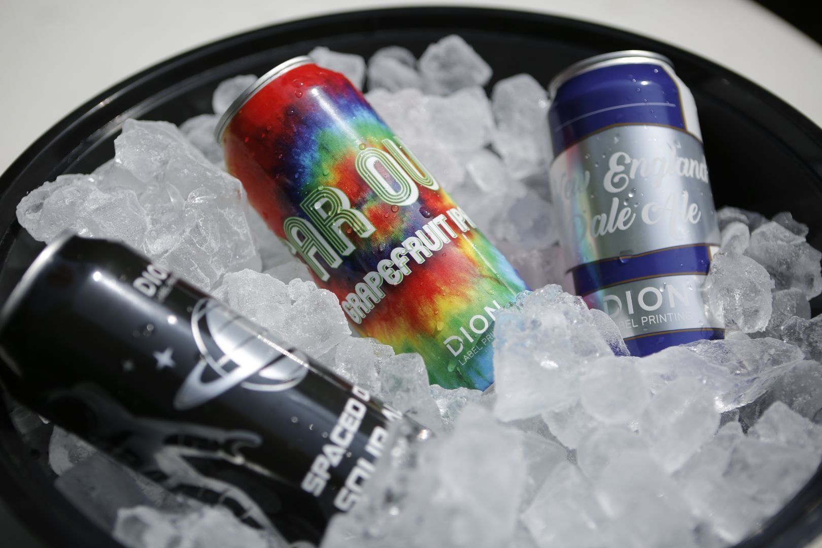 Beer cans with shrink sleeves in ice bucket