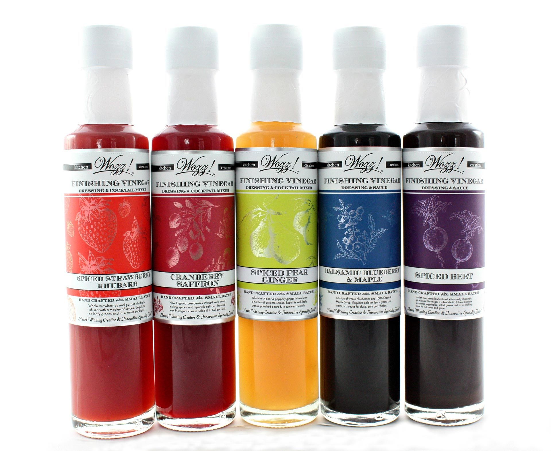 Wozz! Finishing Vinegars lined up with colorful labels