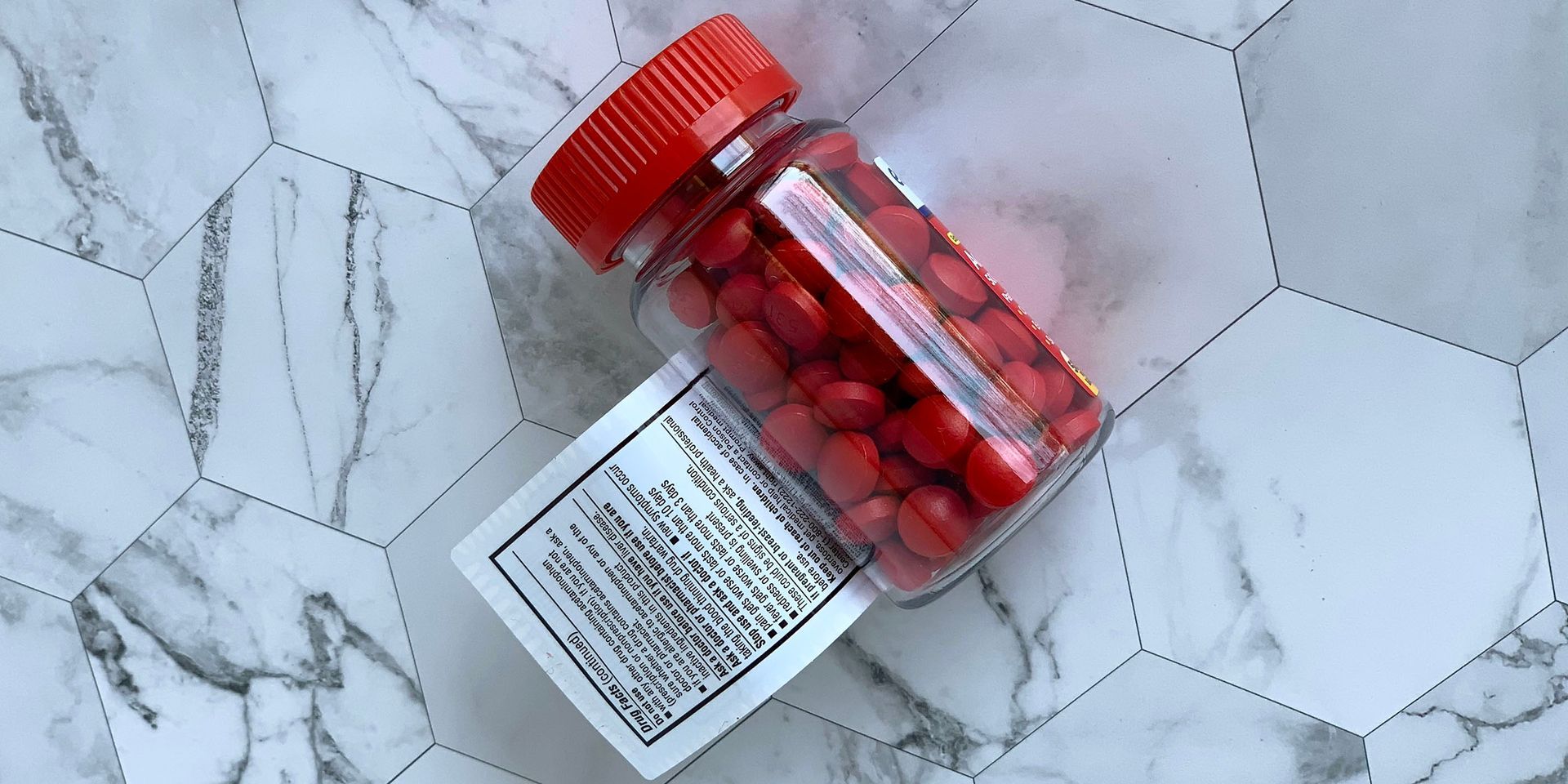 bottle of pills with extended content label
