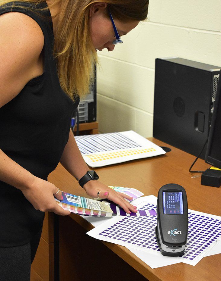 Rachel from our Prepress Team uses spectrophotometer