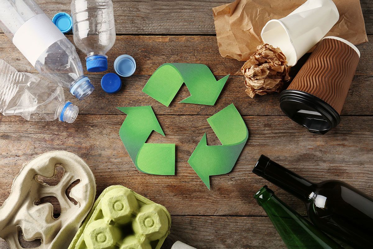Recyling symbol with packaging types around it