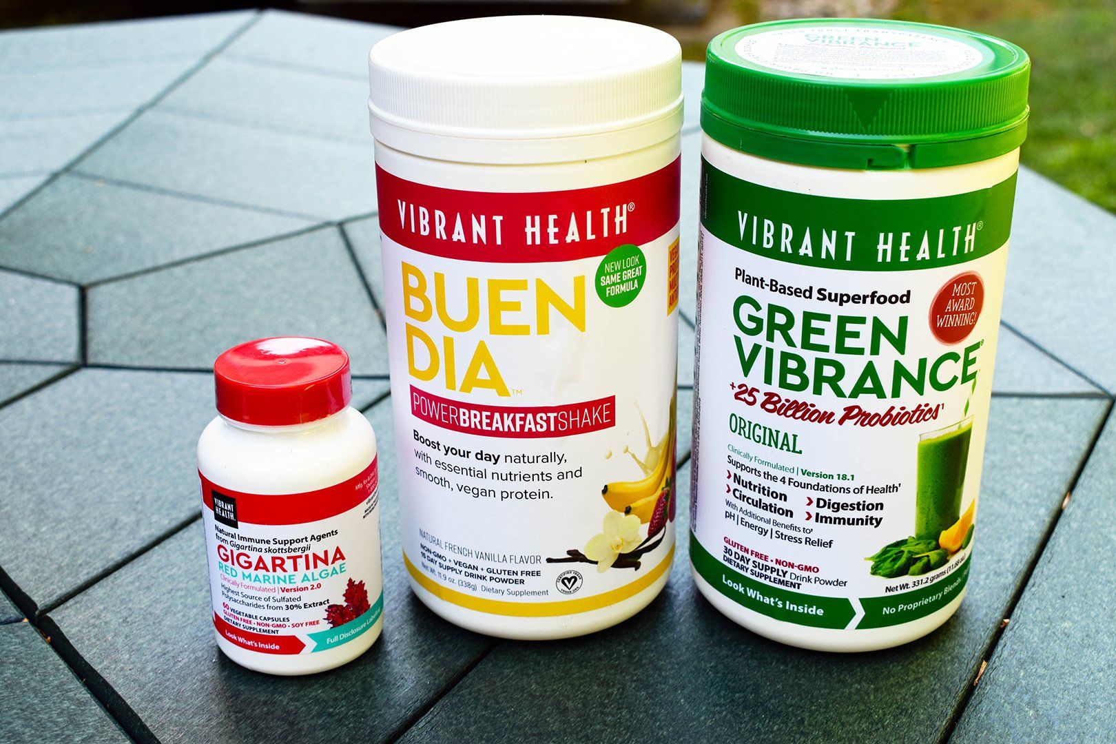 Vibrant Health's Green Vibrance, Buen Dia, and Gigartina on table outside