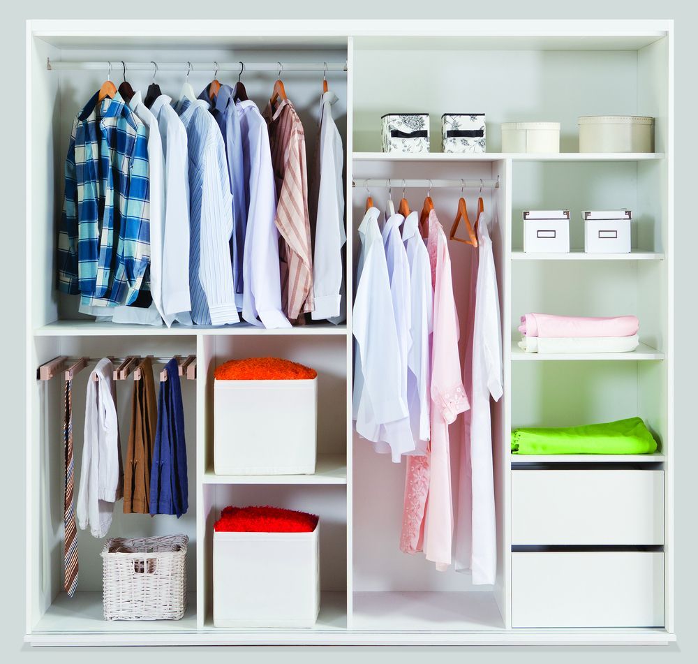 White Closet With Clothes on Hangers and Shelves Containing — Totally Building and Maintenance in Kincumber, NSW