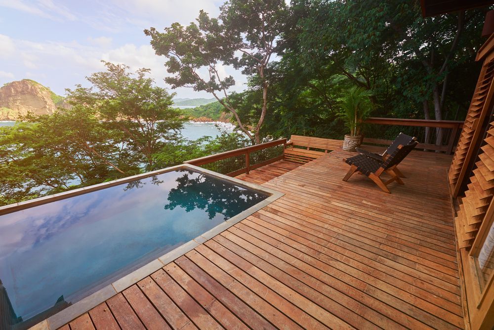 Wooden Deck With a Pool Overlooking a Bay — Totally Building and Maintenance in Kincumber, NSW