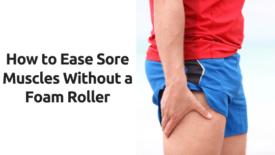 A person is holding their leg in pain.