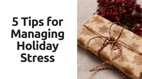 A close up of a gift wrapped in brown paper and tied with string.
