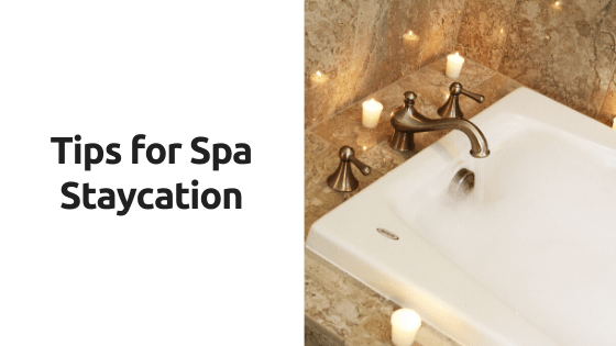 A bathtub with candles around it and the words tips for spa staycation