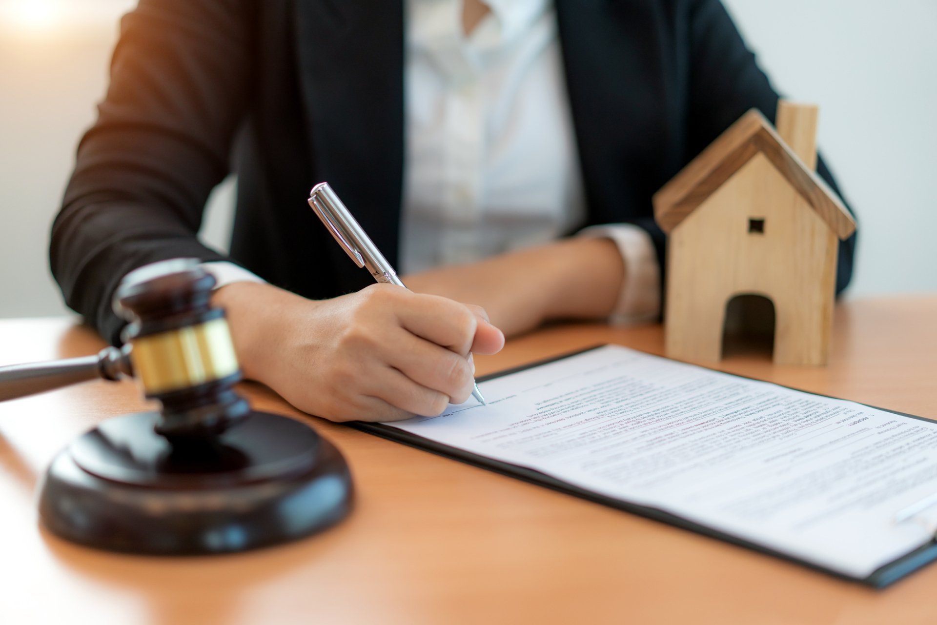 Lawyer Signing Document — High Point, NC – Truman Barker