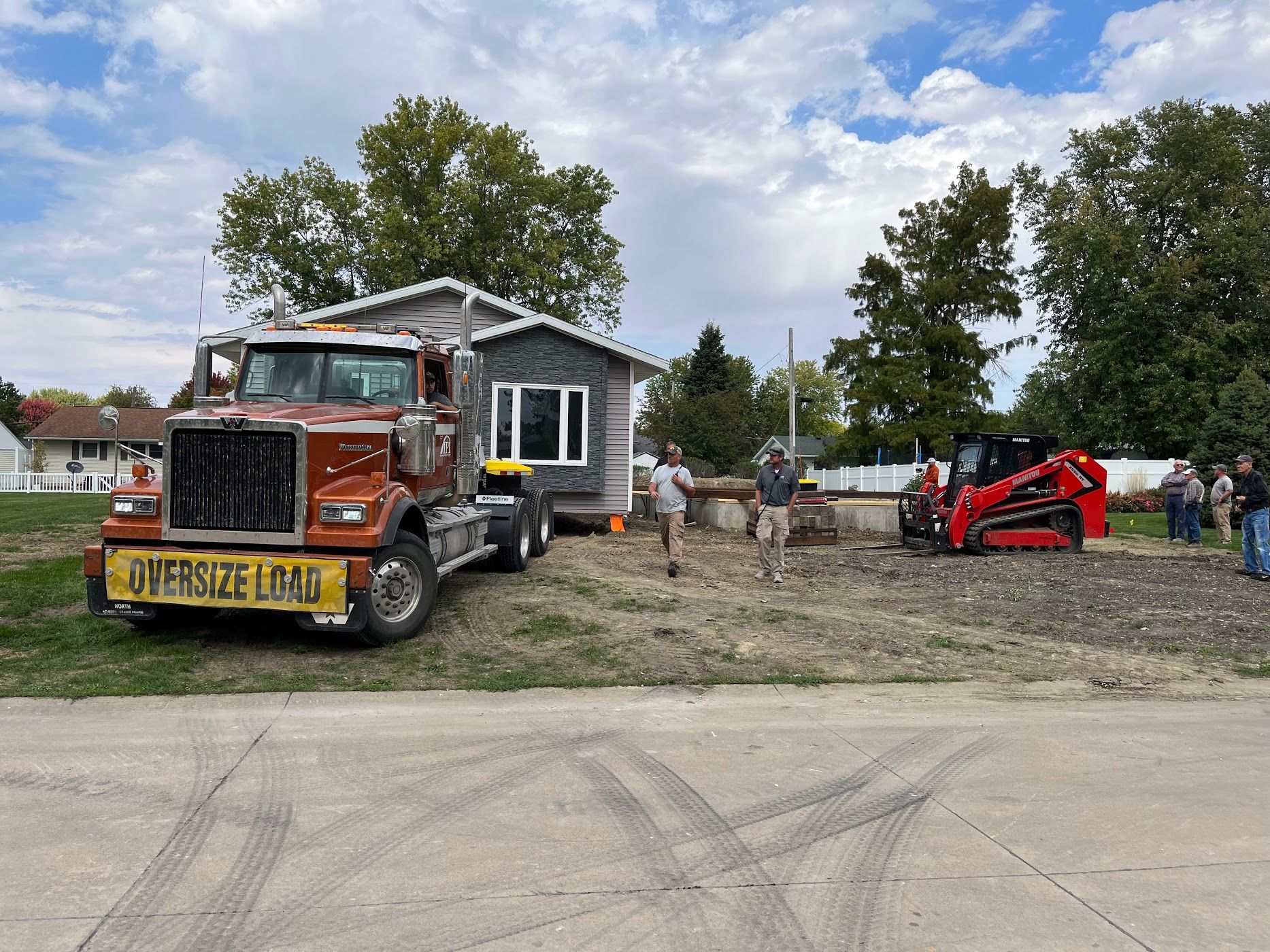 A first-generation HFI house being placed on its foundation