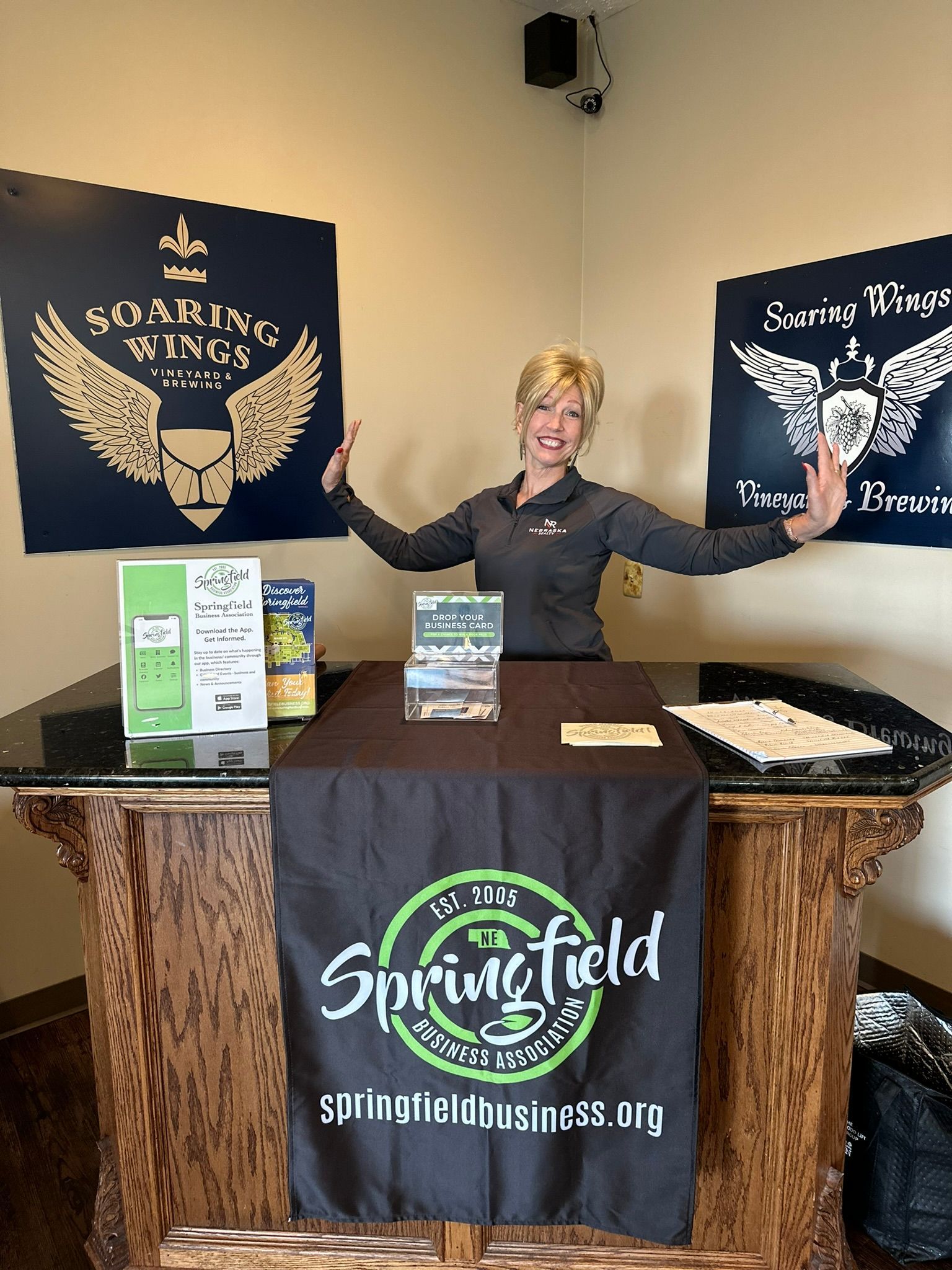 Woman behind a table with a 