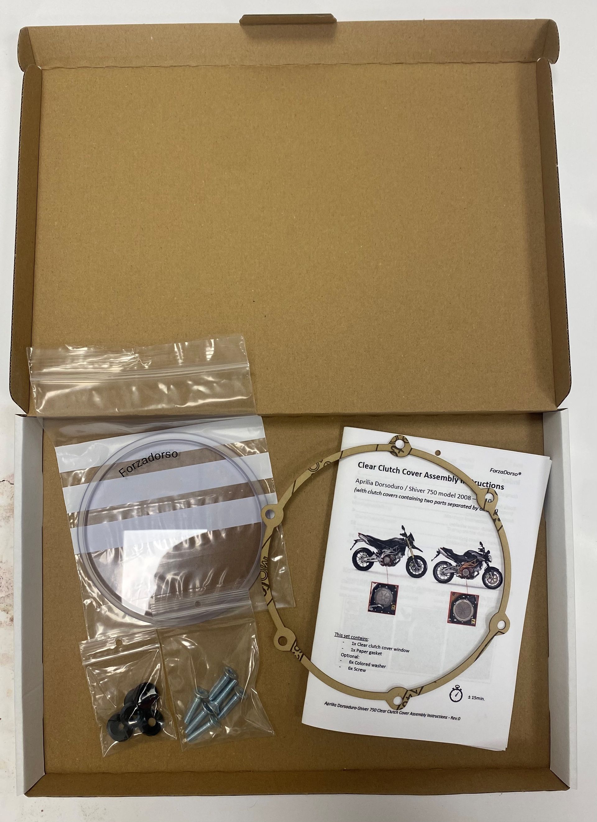 A close up of the transparant clutch cover installed on an Aprilia Dorsoduro 750.