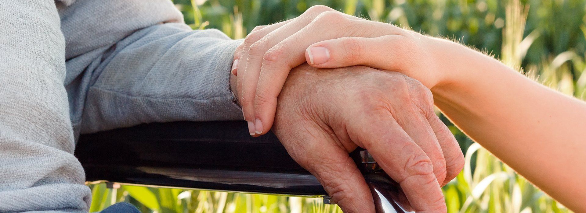 Holding hand of an elderly resident