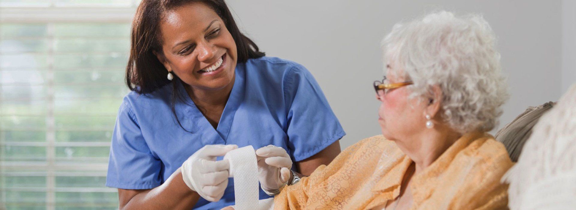 A woman nursing an old woman